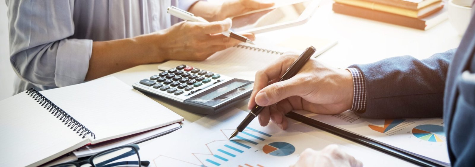 business man financial inspector and secretary making report, calculating or checking balance. Internal Revenue Service inspector checking document. Audit concept